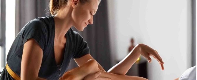 Therapist at majestic touch spa massaging clients leg