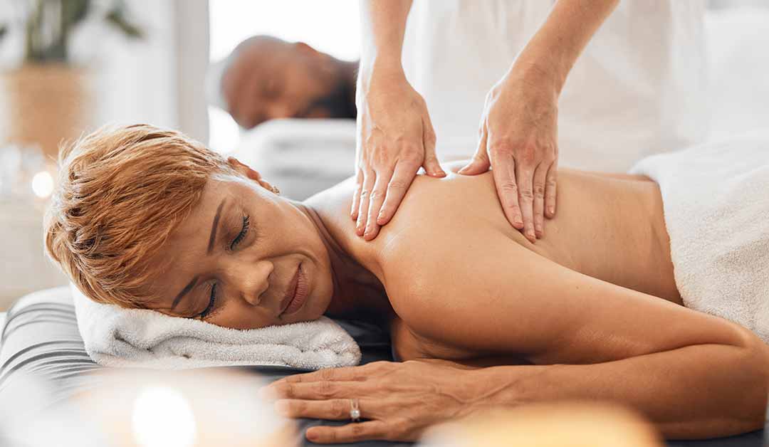 Mature Couple getting shoulder massage at majestic medical touch spa
