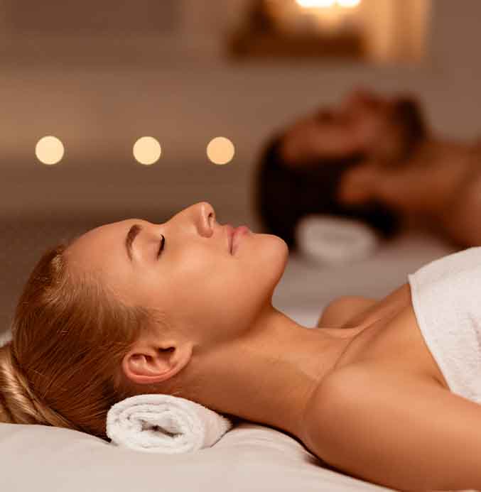 Couple enjoying mobile massage in the comfort of the home