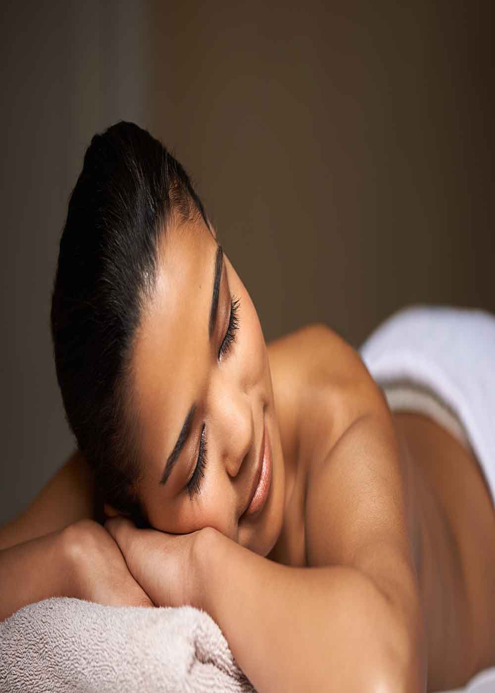 beautiful Woman Laying on Massage table relaxing at majestic medical touch spa